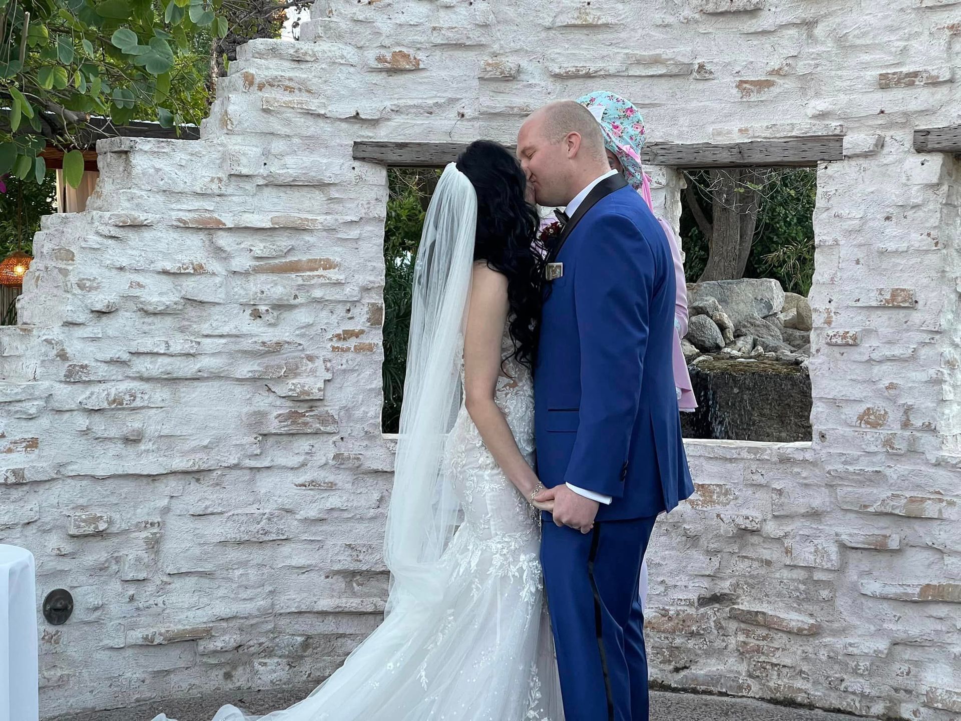 newly married couple kisses