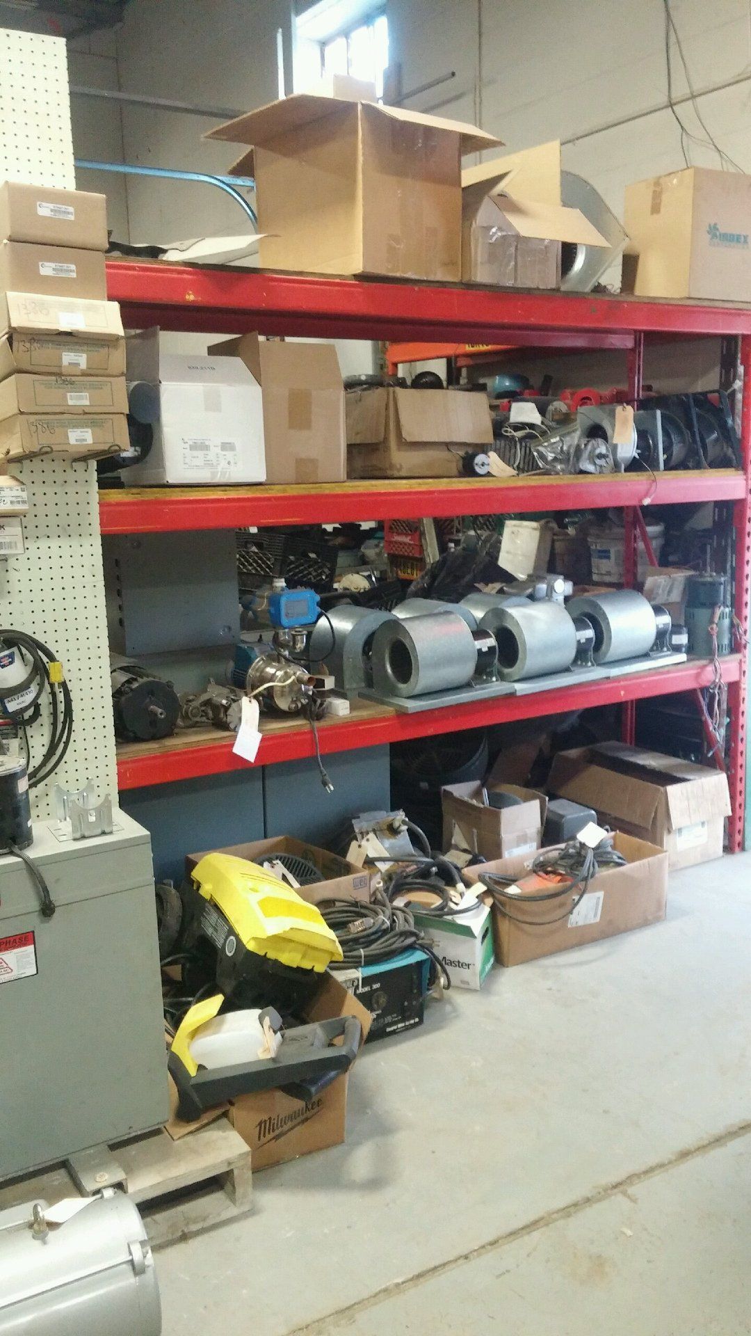 A warehouse filled with lots of boxes and equipment.