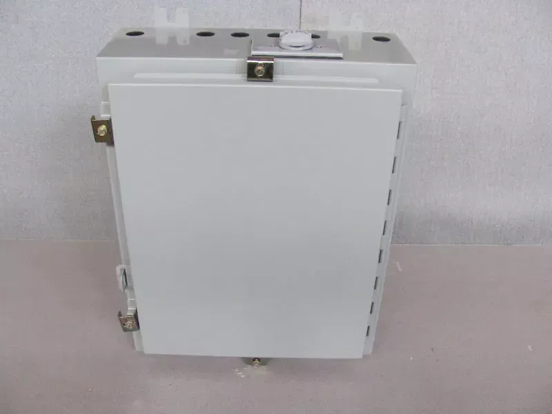 A white box is sitting on a white table.