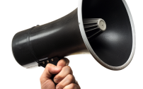 A person is holding a black megaphone in their hand.