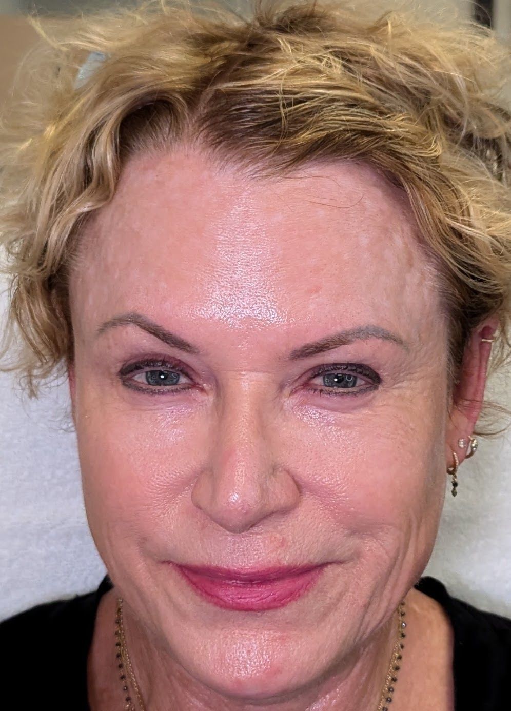 A close up of a woman 's face without makeup.