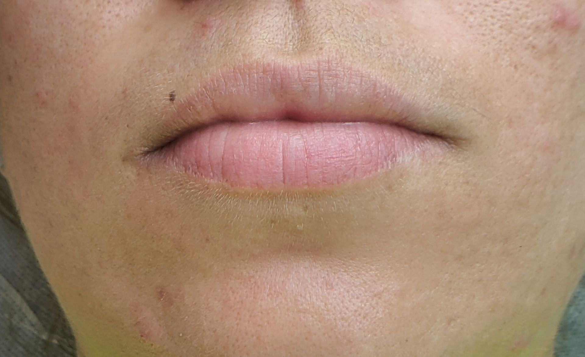 A close up of a woman 's lips and face.