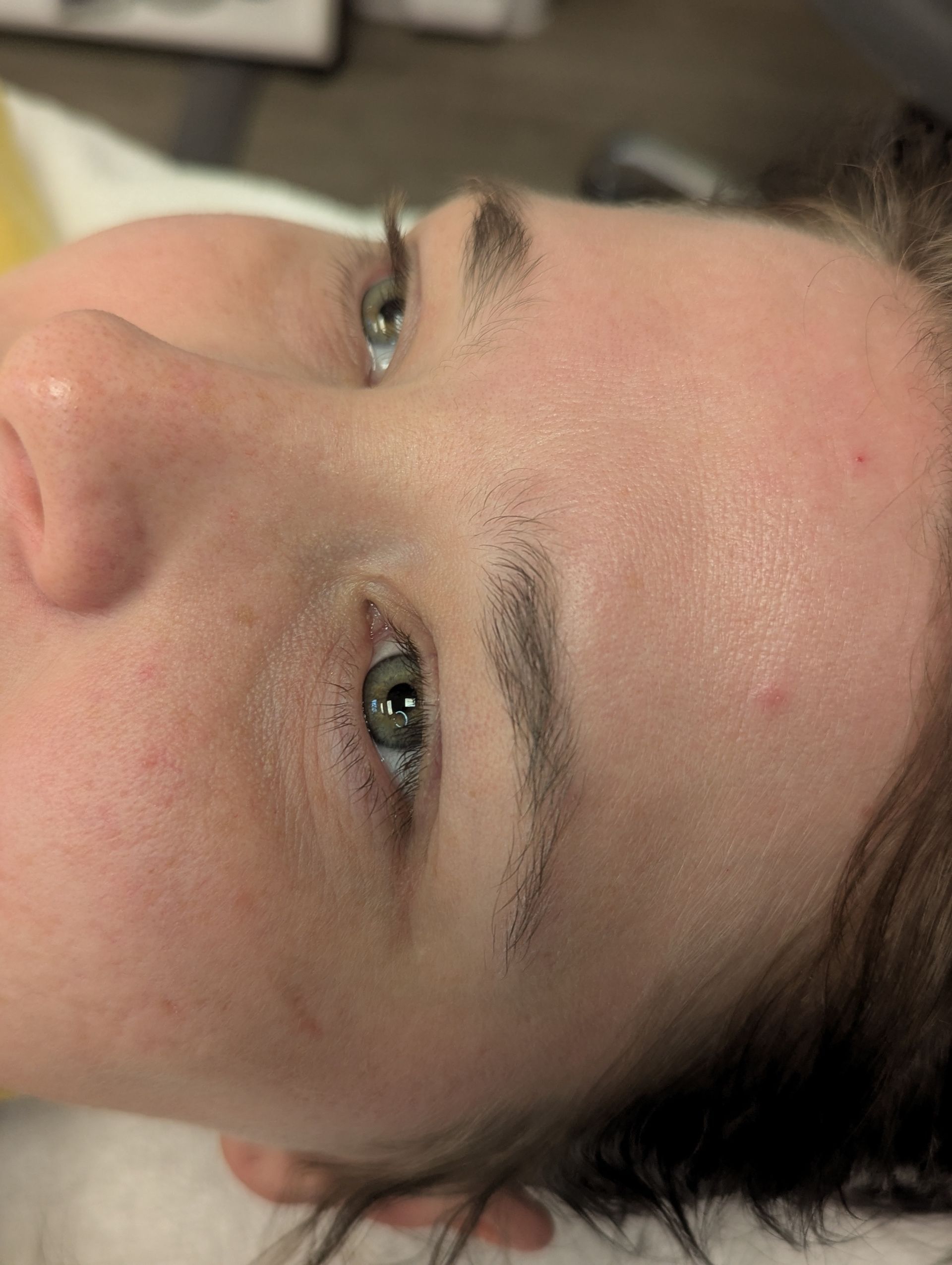 A close up of a woman 's face and eyebrows.