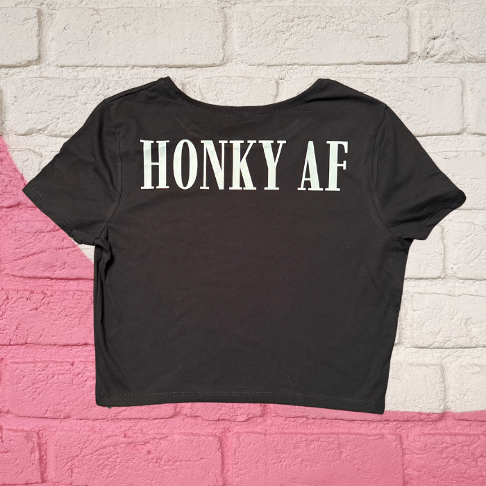 A black crop top that says rocket city on it