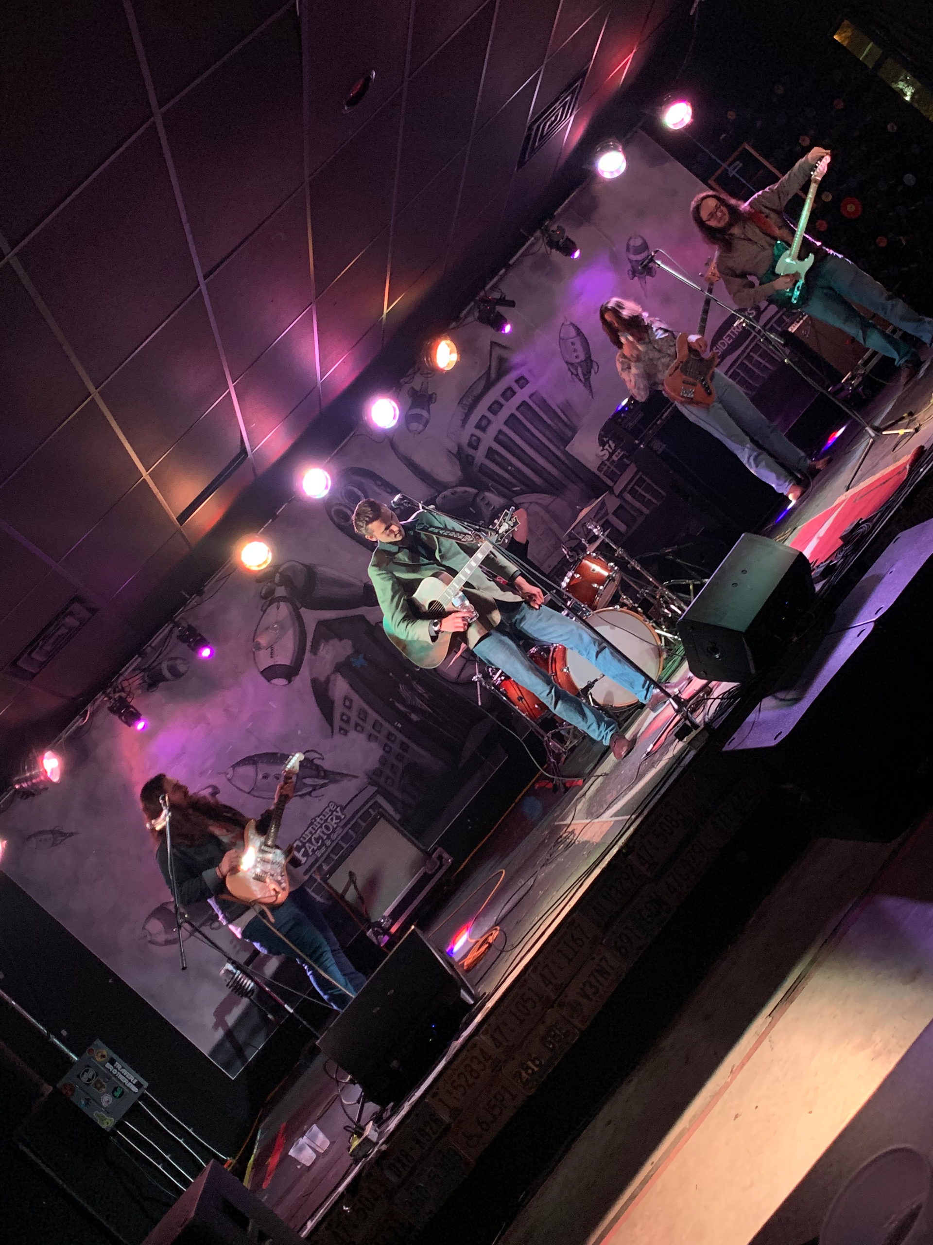 A group of people are playing instruments on a stage.