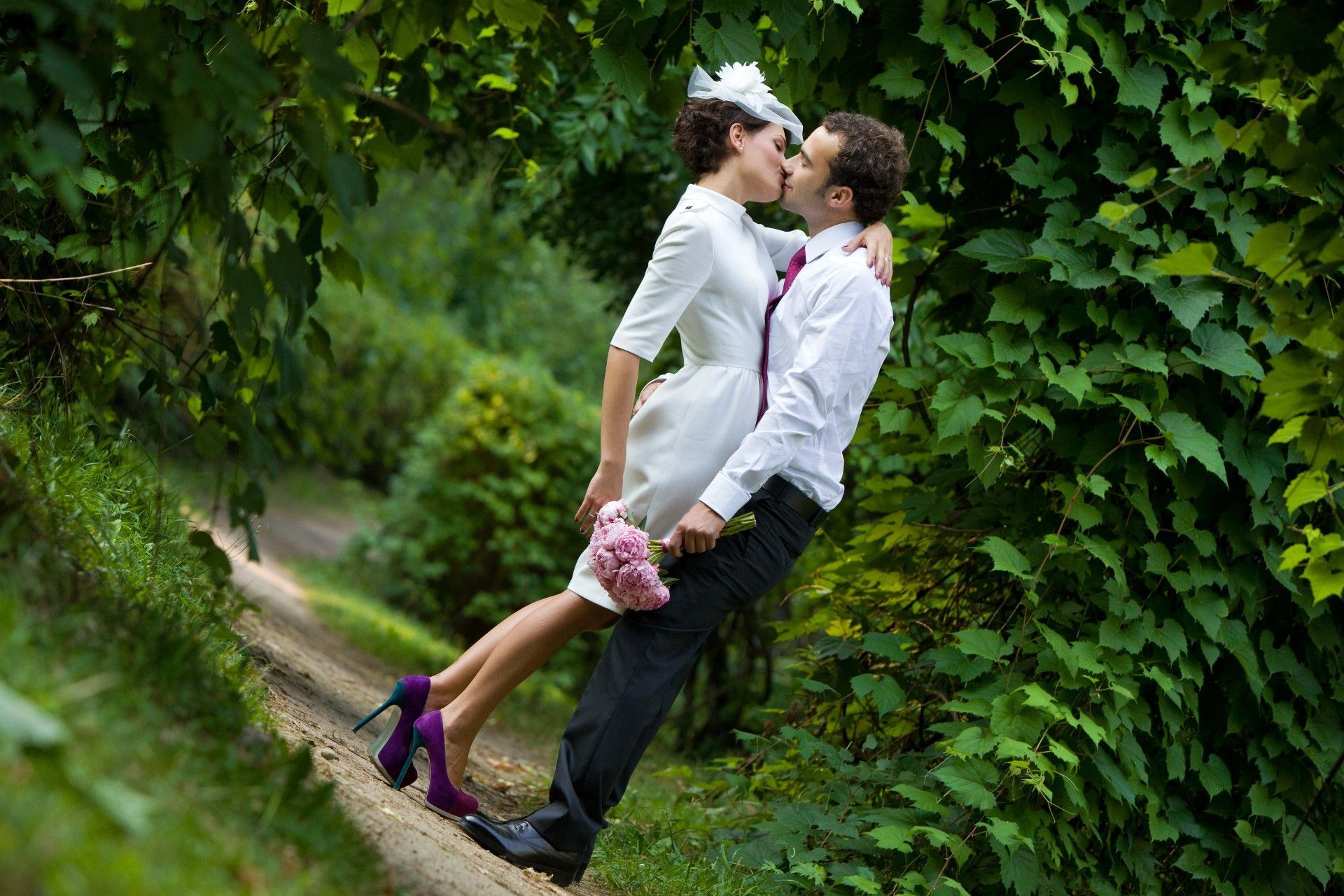 Bride and groom sharing a kiss to symbolize their union as husband and wife