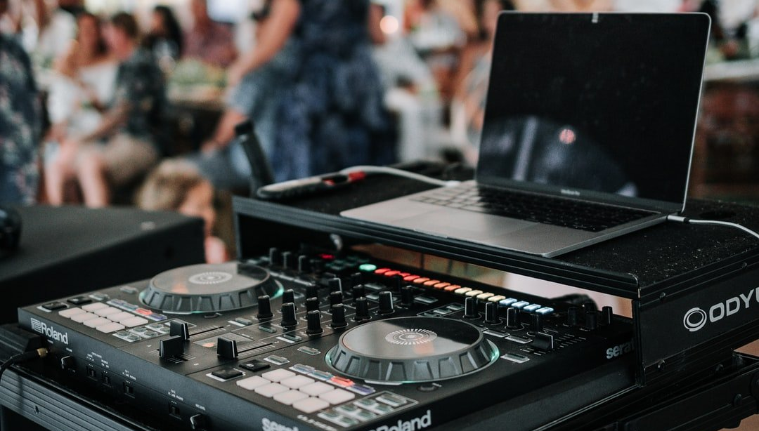 DJ equipment and laptop set up at wedding event
