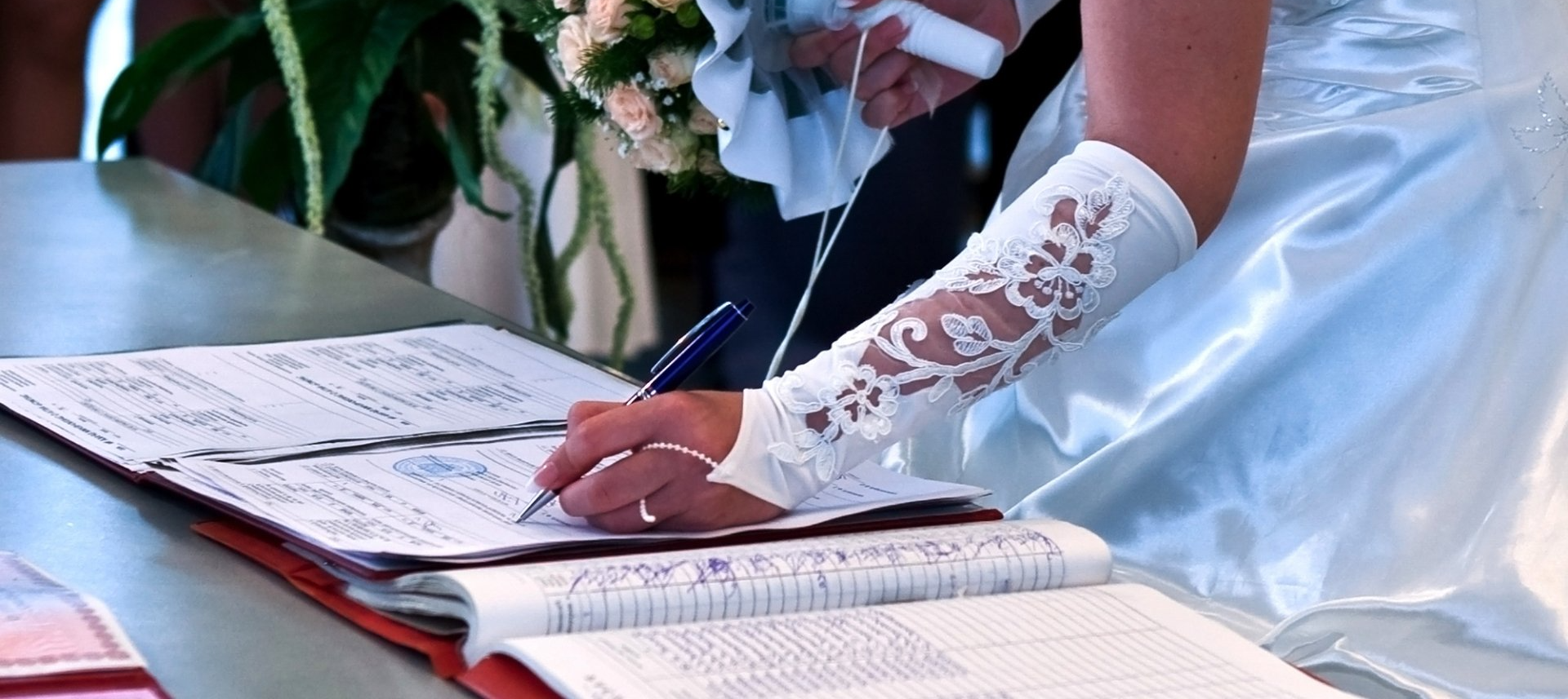 bride signing a marriage license