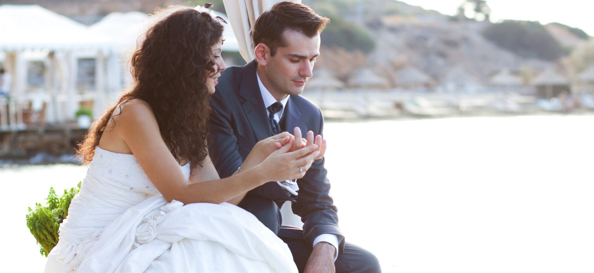 newlywed couple talking at wedding