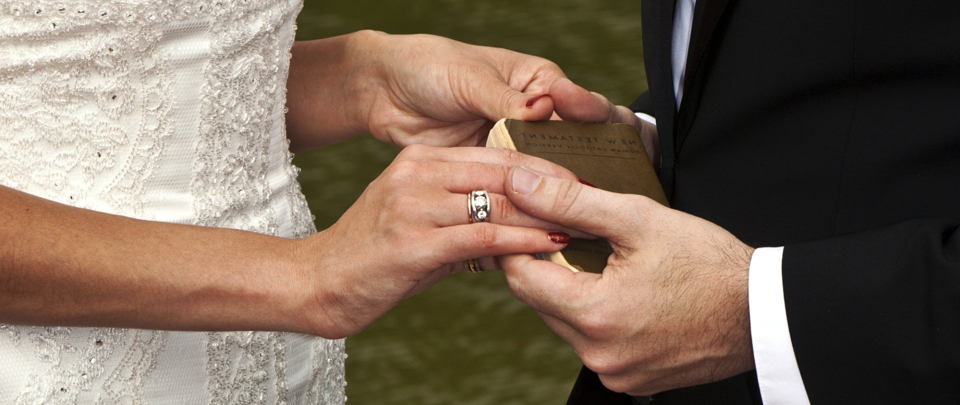 Newlyweds holding hands at wedding ceremony