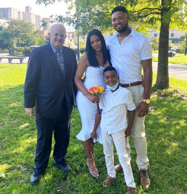 New York wedding ceremony officiant with newly married couple at  Joyce Kilmer Park in the Bronx