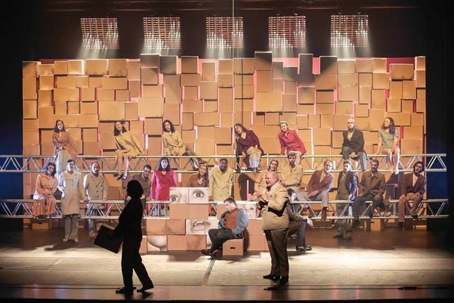 Cantor Dan Pincus singing on-stage in theater performance