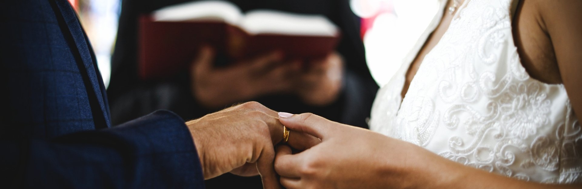 couple saying their vows in front of officiant