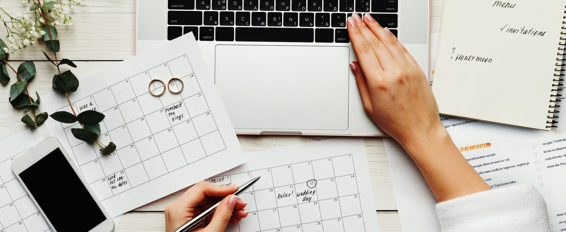 a beautiful top view of wedding planner hands while working