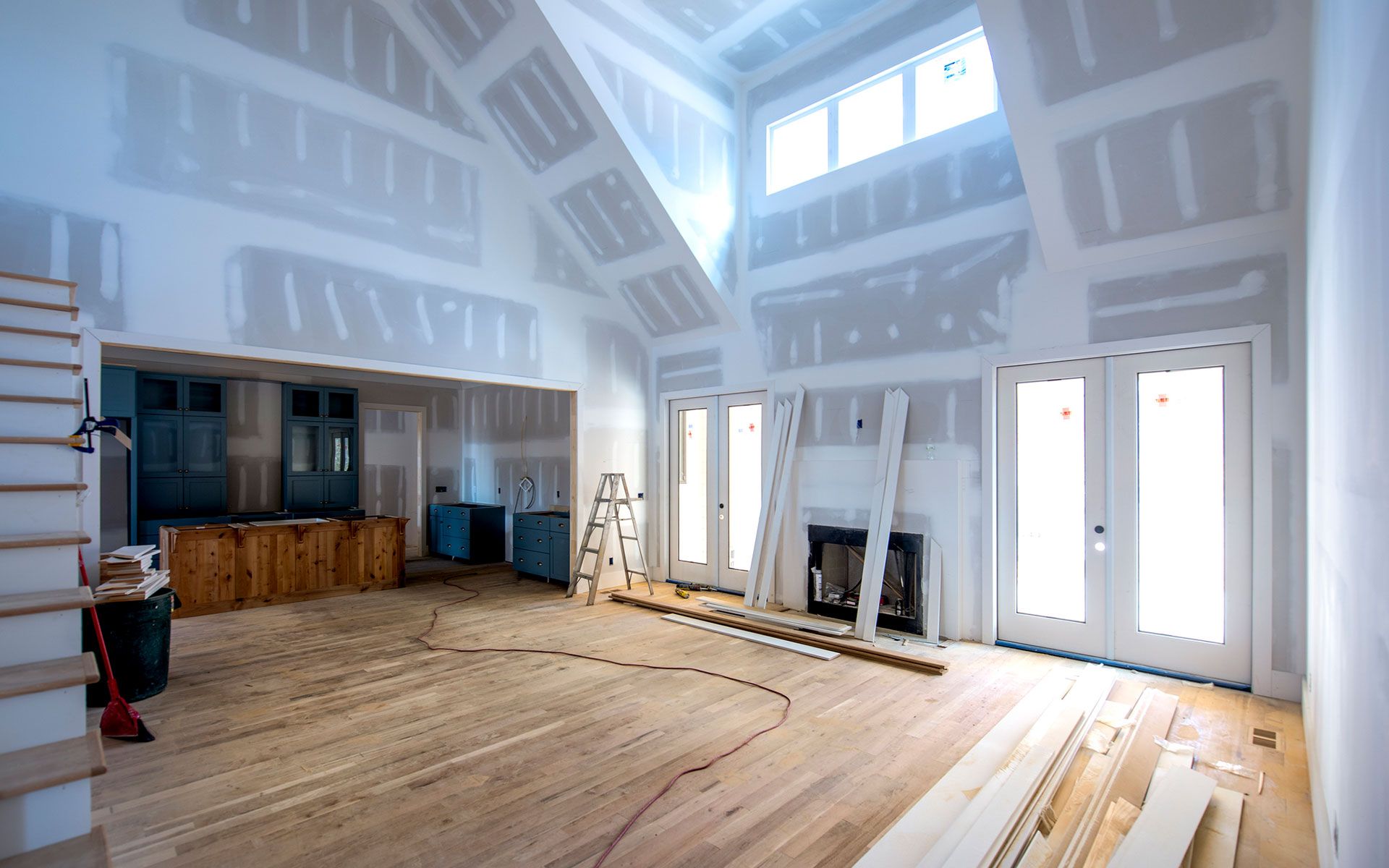 A room that is being remodeled with drywall on the walls
