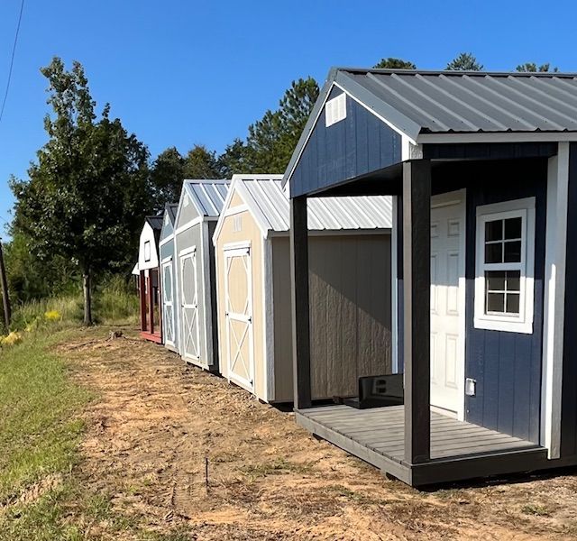 A row of sheds are lined up next to each other