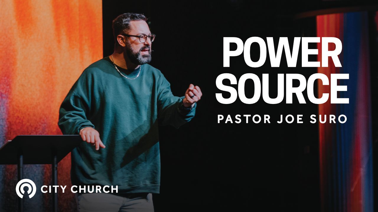 Pastor Eugene Smith preaching during the City Church message titled ‘Thankfulness Changes Everything’ with a blue illustrated background.