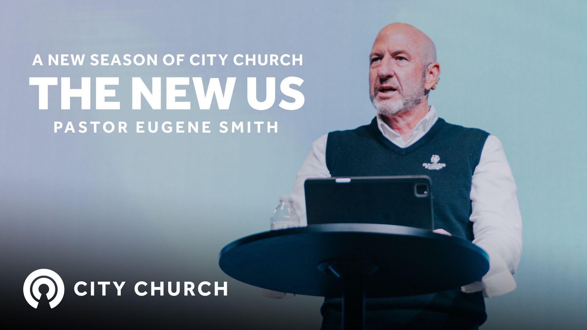 Pastor Eugene Smith preaching during the City Church message titled ‘Thankfulness Changes Everything’ with a blue illustrated background.
