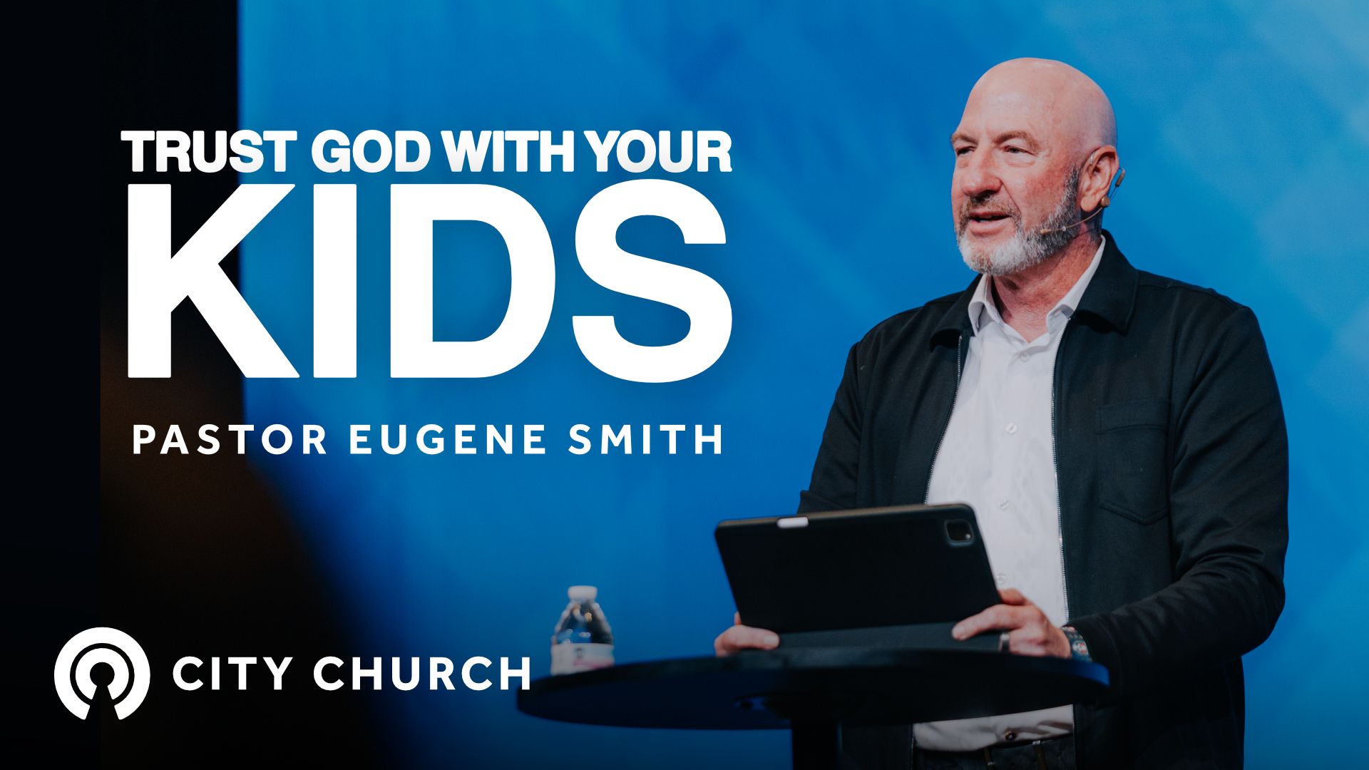 Pastor preaching during the City Church message titled ‘Thankfulness Changes Everything’ with a blue illustrated background.