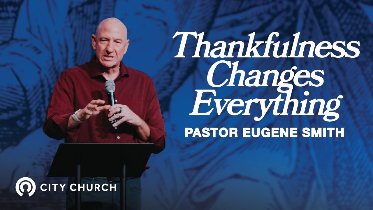 Pastor Eugene Smith preaching during the City Church message titled ‘Thankfulness Changes Everything’ with a blue illustrated background.