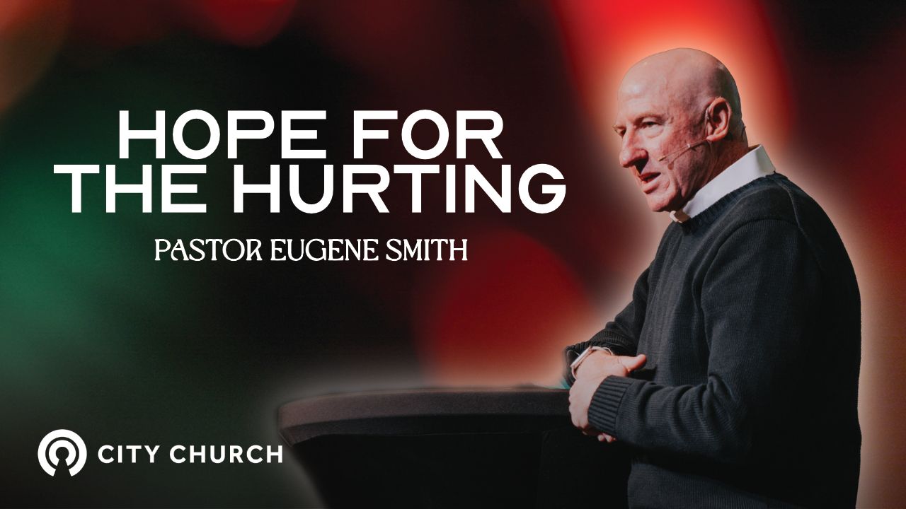 Pastor Eugene Smith preaching during the City Church message titled ‘Thankfulness Changes Everything’ with a blue illustrated background.