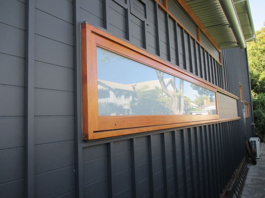 Long Wooden-Framed Horizontal Window on A Dark Exterior Wall — Fineworx Joinery in Warnervale, NSW