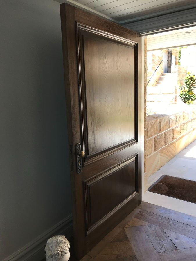 Open Wooden Front Door with Bright Outdoor Entryway Beyond — Fineworx Joinery in Warnervale, NSW