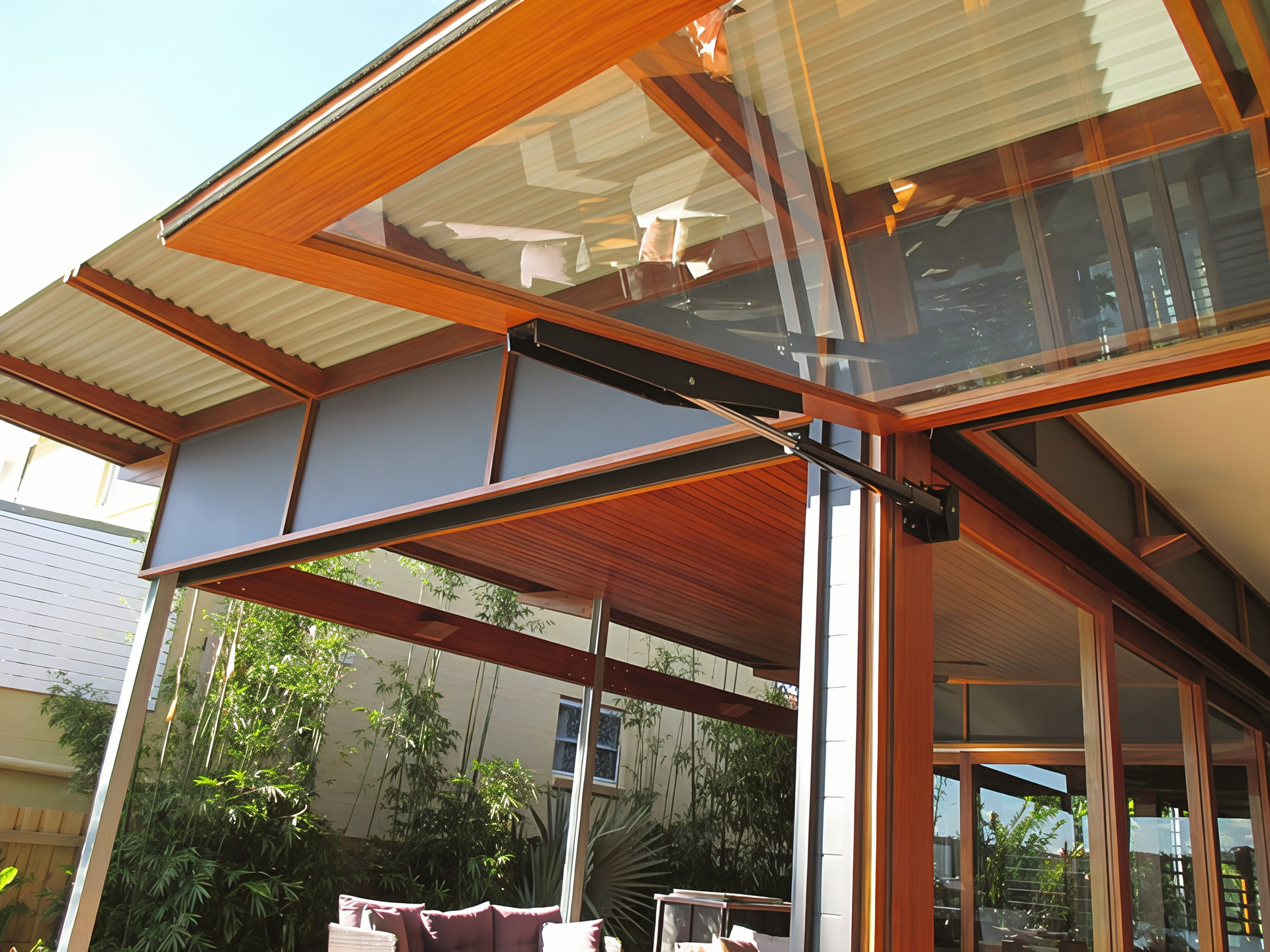 Modern House with Orange Roof and Metal Supports Under a Covered Patio — Fineworx Joinery in Warnervale, NSW