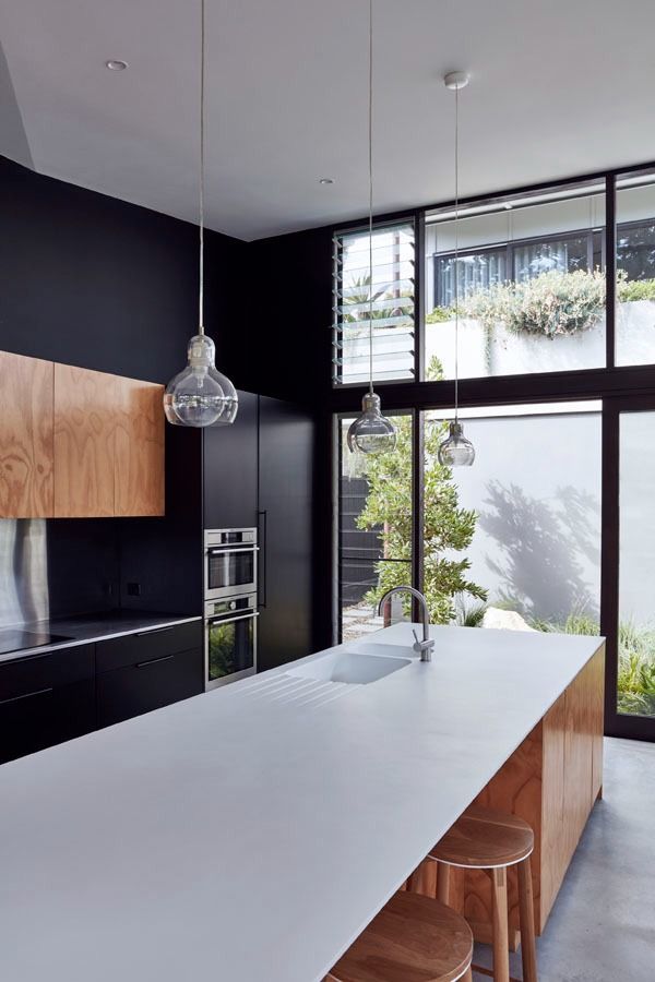 Modern Kitchen with A Large White Island and Tall Windows — Fineworx Joinery in Newcastle, NSW