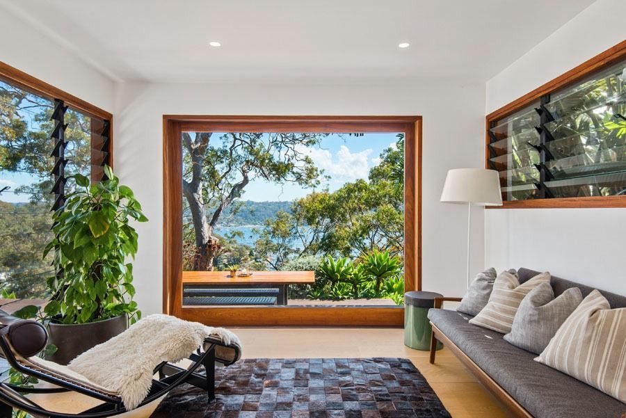 Modern Living Room with Large Windows and A View of Water and Trees — Fineworx Joinery in Sydney, NSW