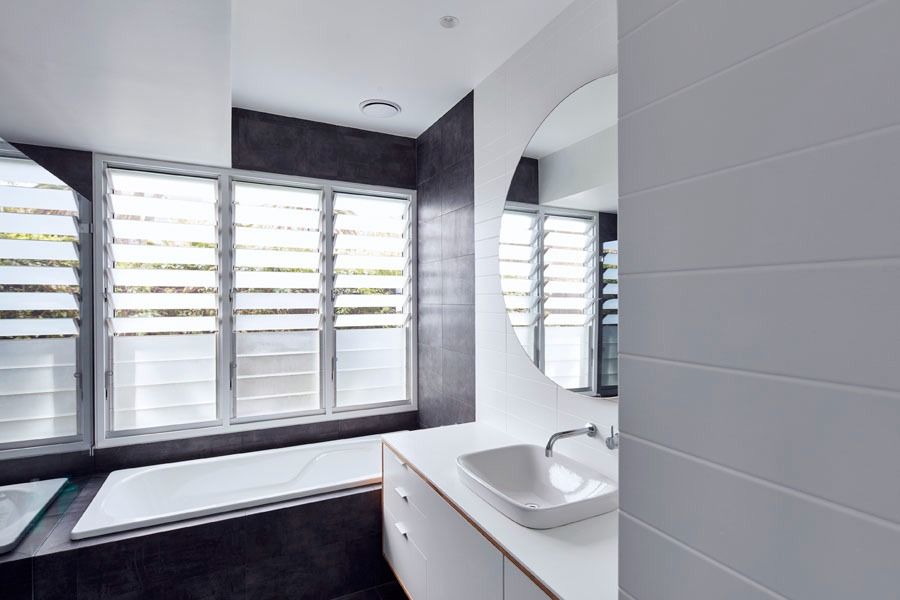Modern Bathroom with Bathtub and Louvered Window Shutters — Fineworx Joinery in Newcastle, NSW