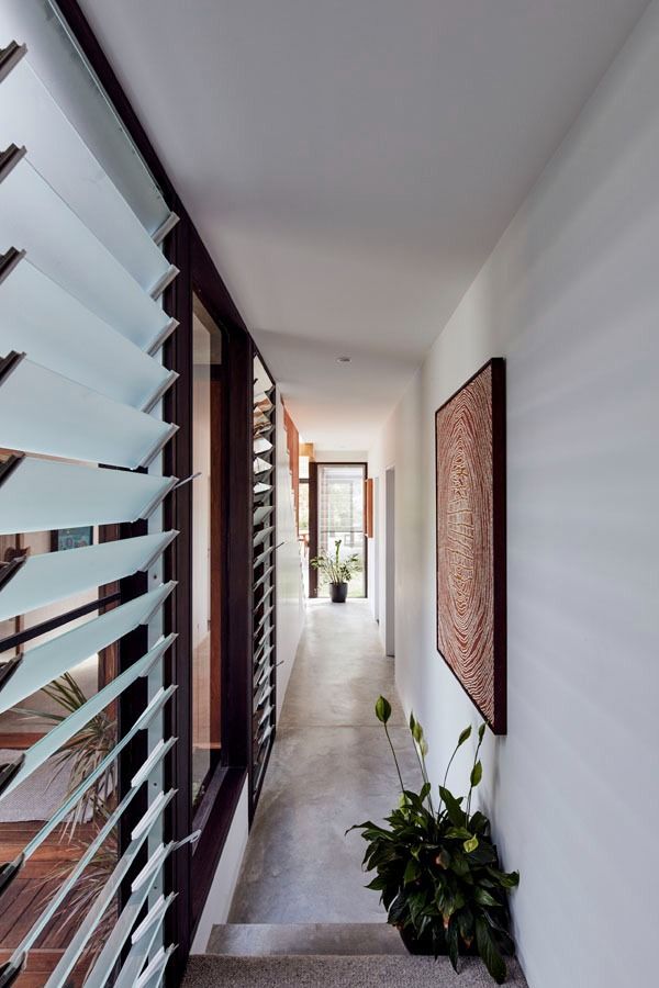 Narrow Indoor Hallway with White Walls and Louvered Windows — Fineworx Joinery in Warnervale, NSW