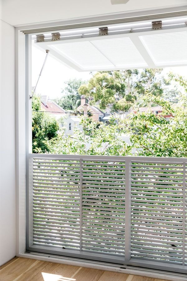 Open Balcony with White Louvered Railing and Leafy Trees Beyond — Fineworx Joinery in Warnervale, NSW