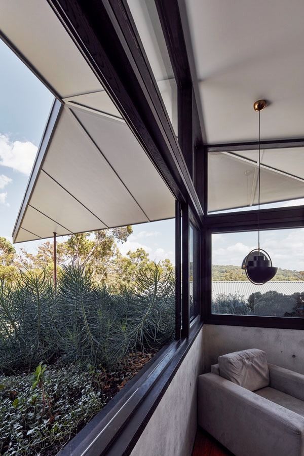 Modern Corner Balcony with Retractable Awning — Fineworx Joinery in Newcastle, NSW