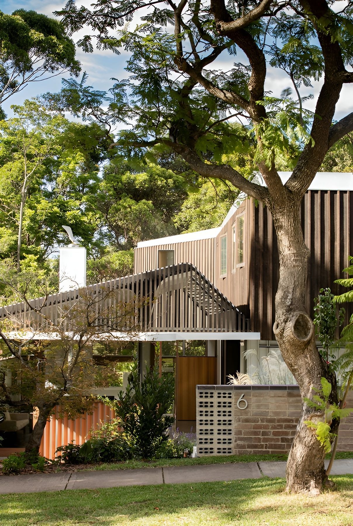 Modern House Partly Hidden by Large Trees and Greenery — Fineworx Joinery in Warnervale, NSW