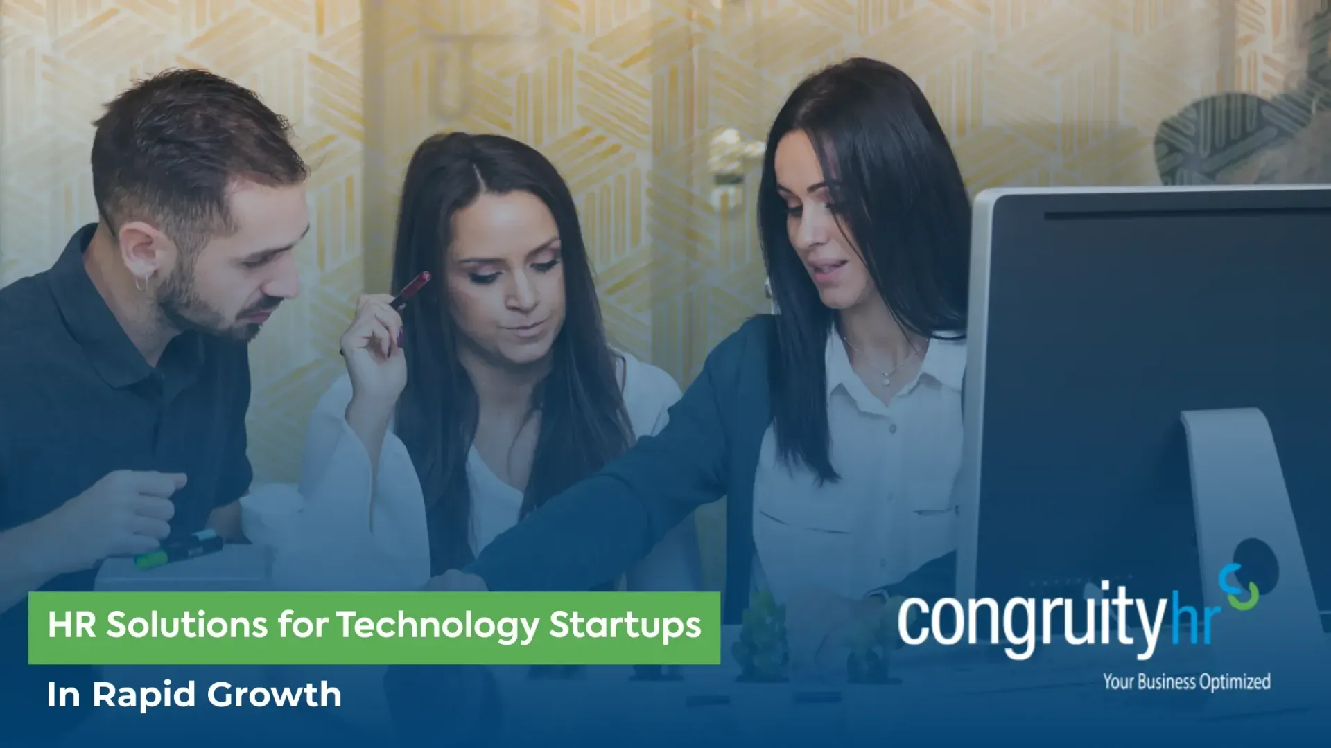 Three people looking at a computer screen, discussing HR solutions for tech startups. Company logo visible.