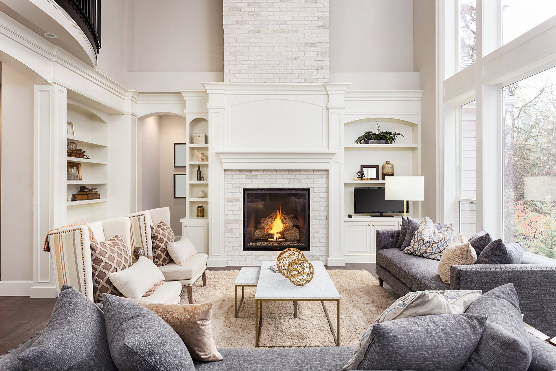 A bright living room with a fireplace.