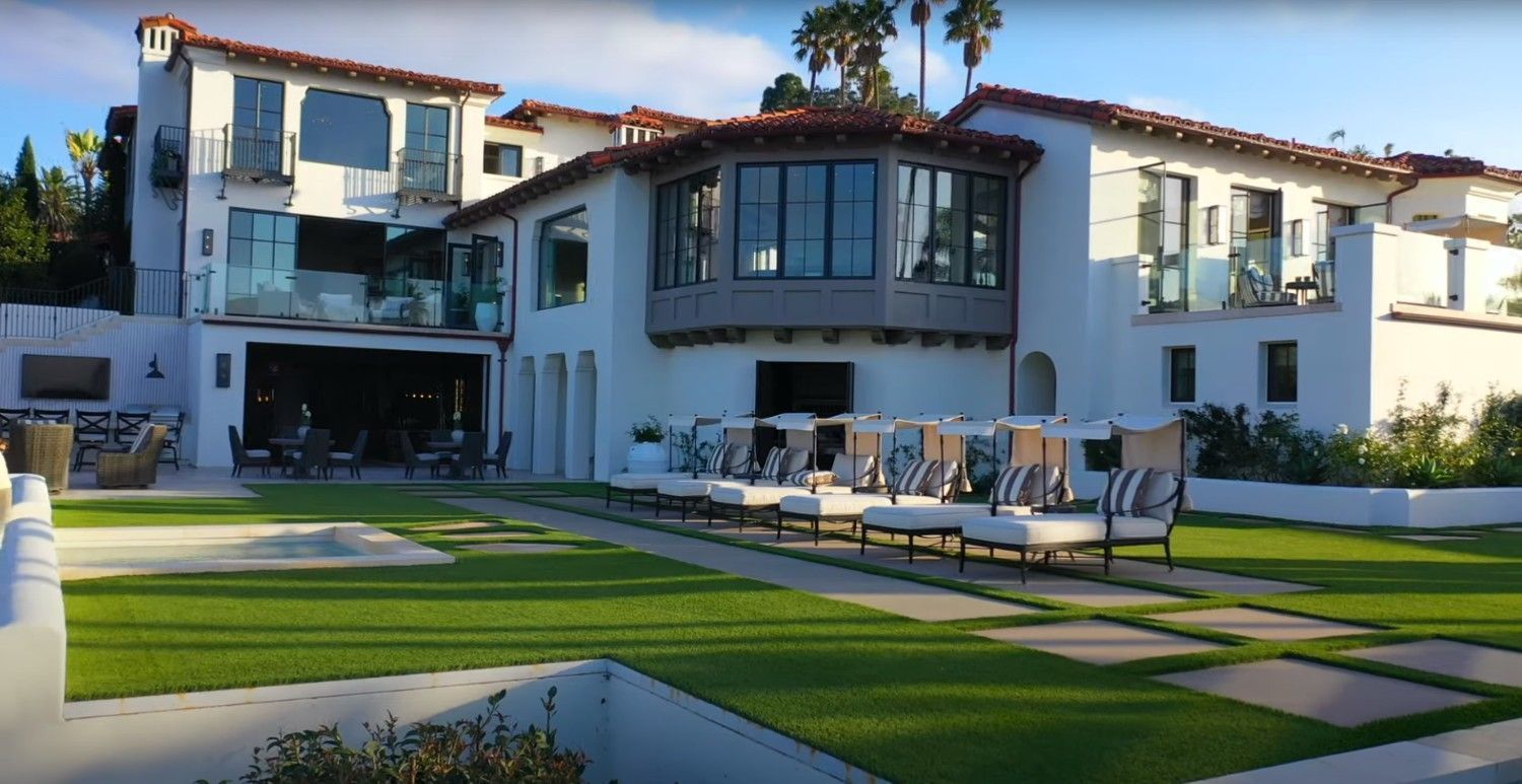 Exterior view of a large Spanish revival style house.