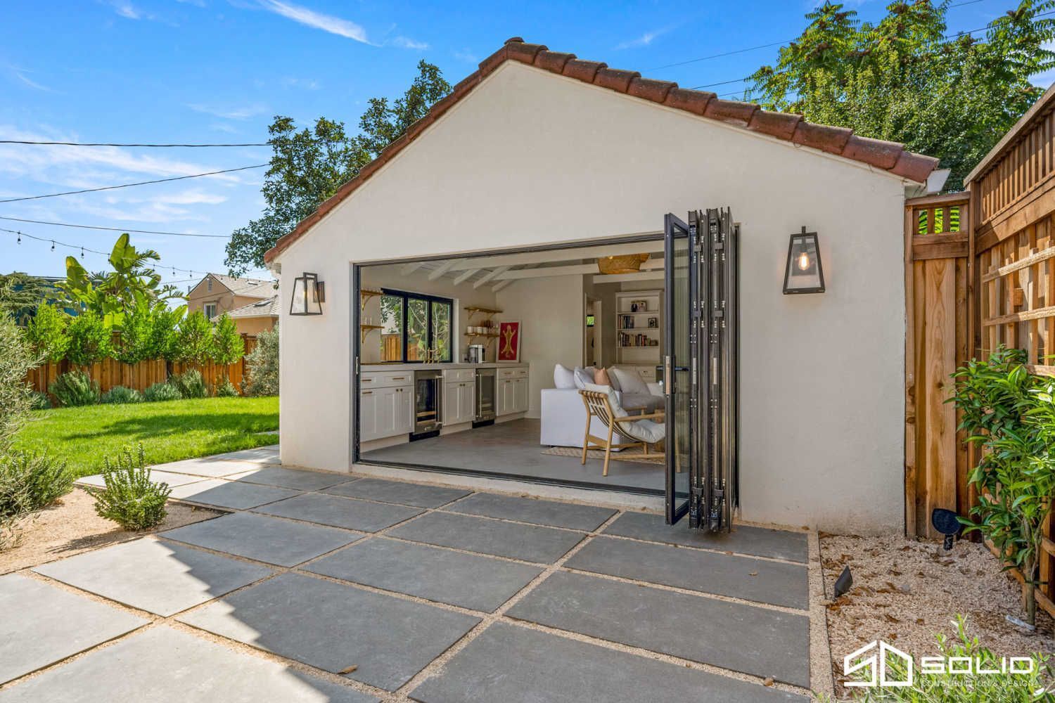 An artist's impression of a house with a lot of windows