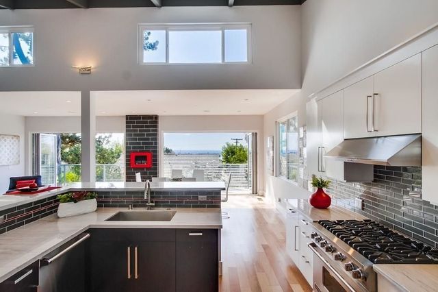 A kitchen with stainless steel appliances and a sink