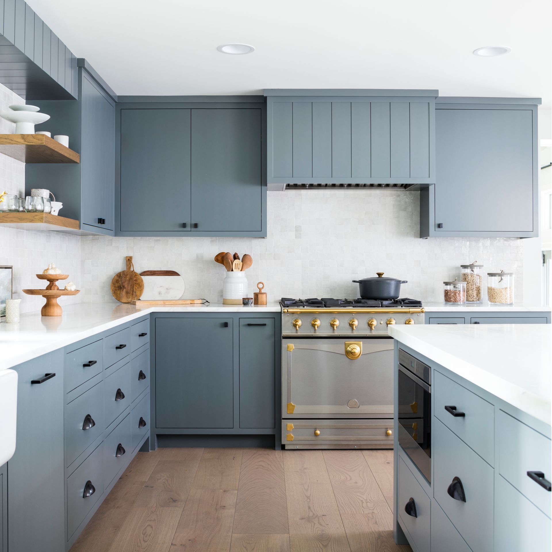 Blue cabinets in a nice kitchen.