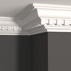Close up of crown moulding and a dark grey wall