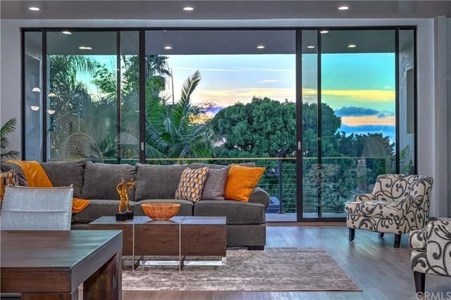 A living room with sliding glass doors and a couch