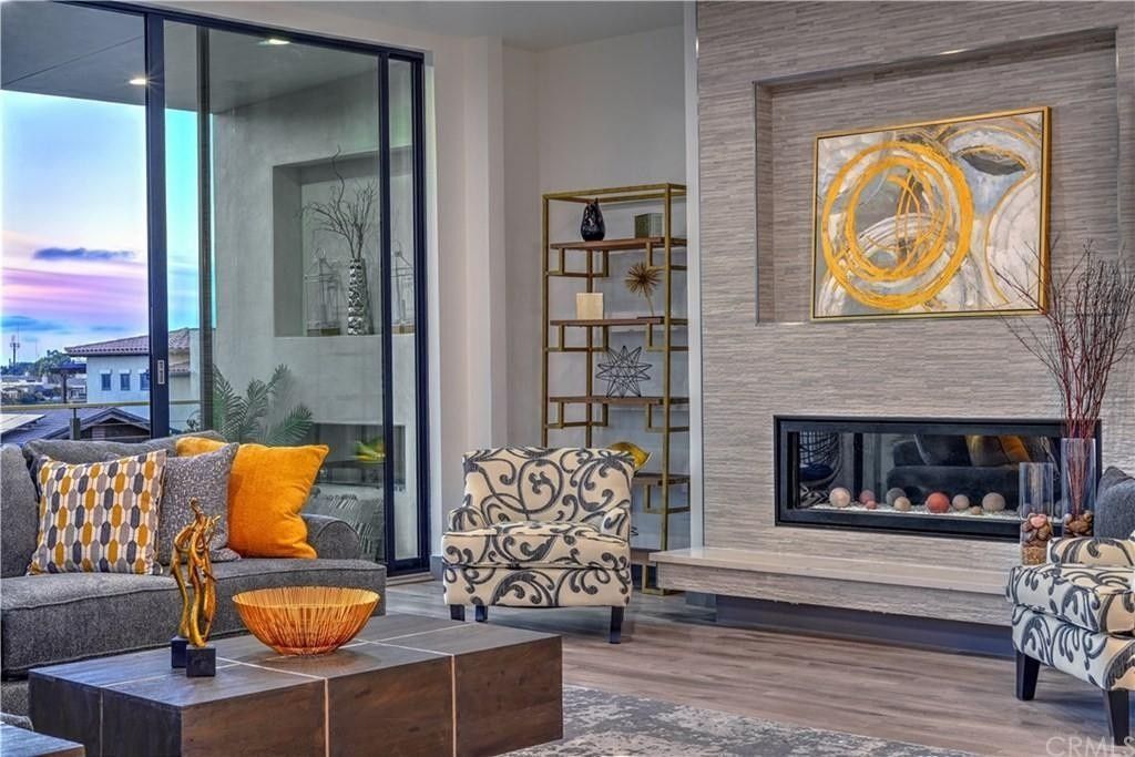 A living room filled with furniture and a fireplace.