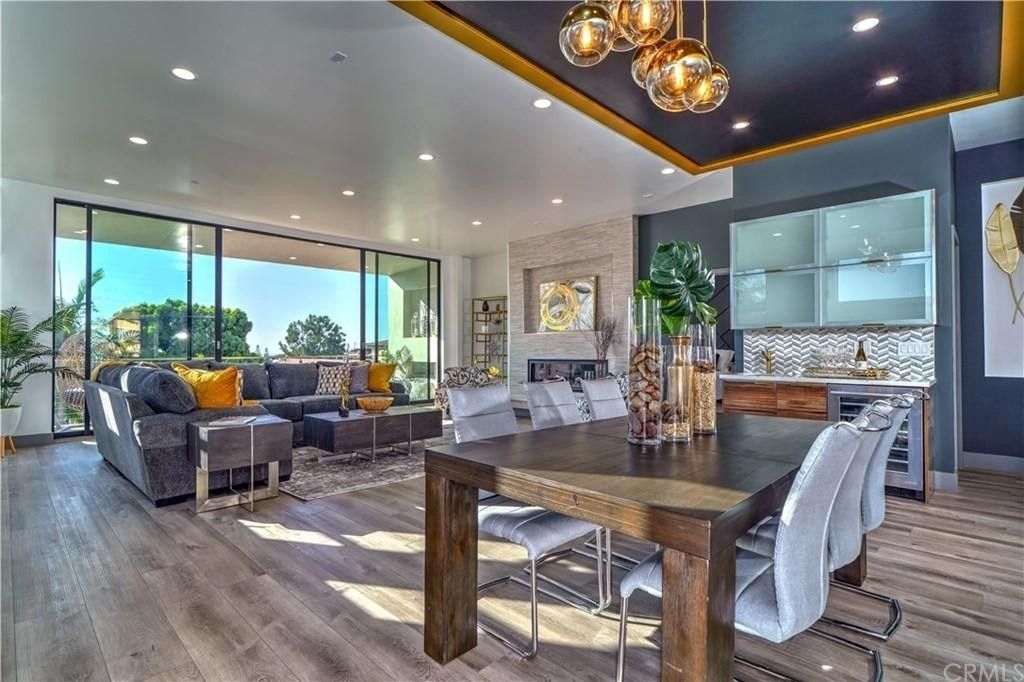 A living room with a dining table and chairs