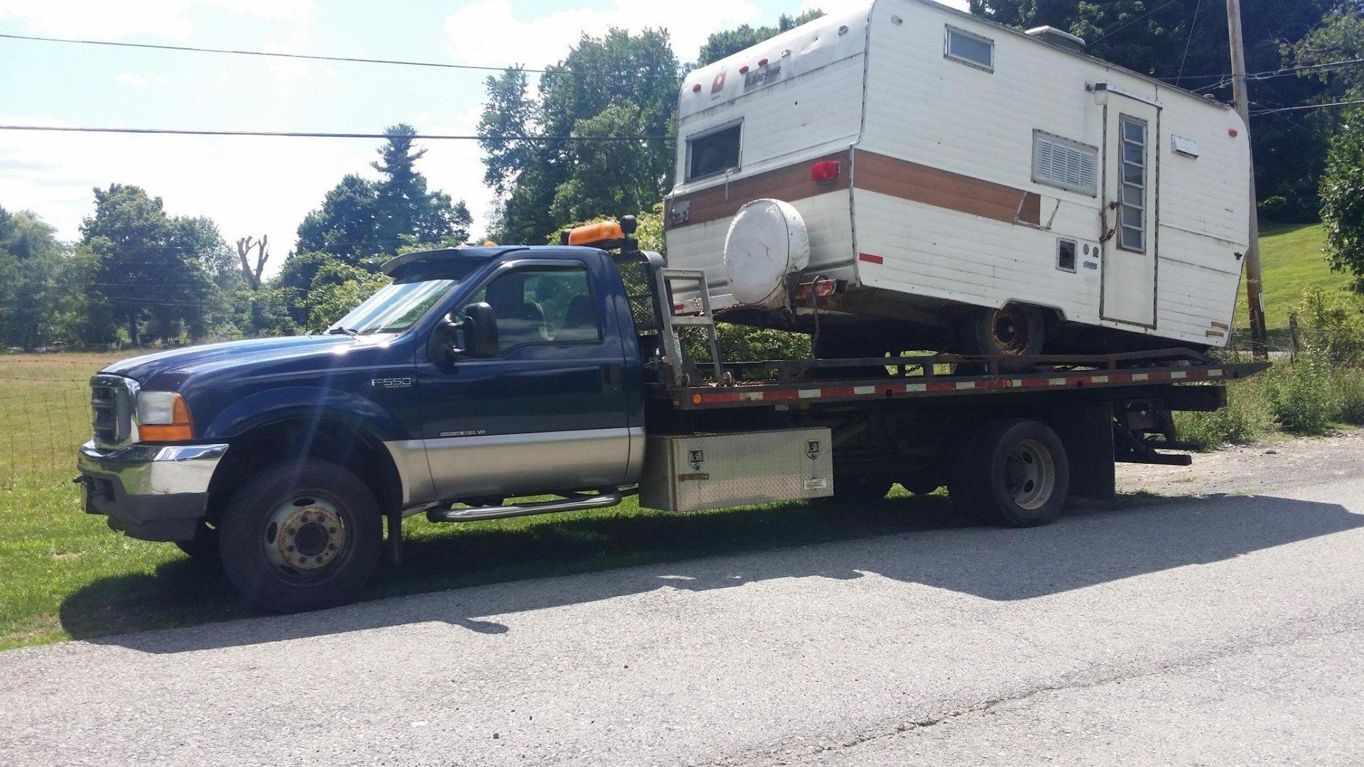 Damaged Vehicle on a Tow Truck — Wallkill, NY — On the Road Again Towing