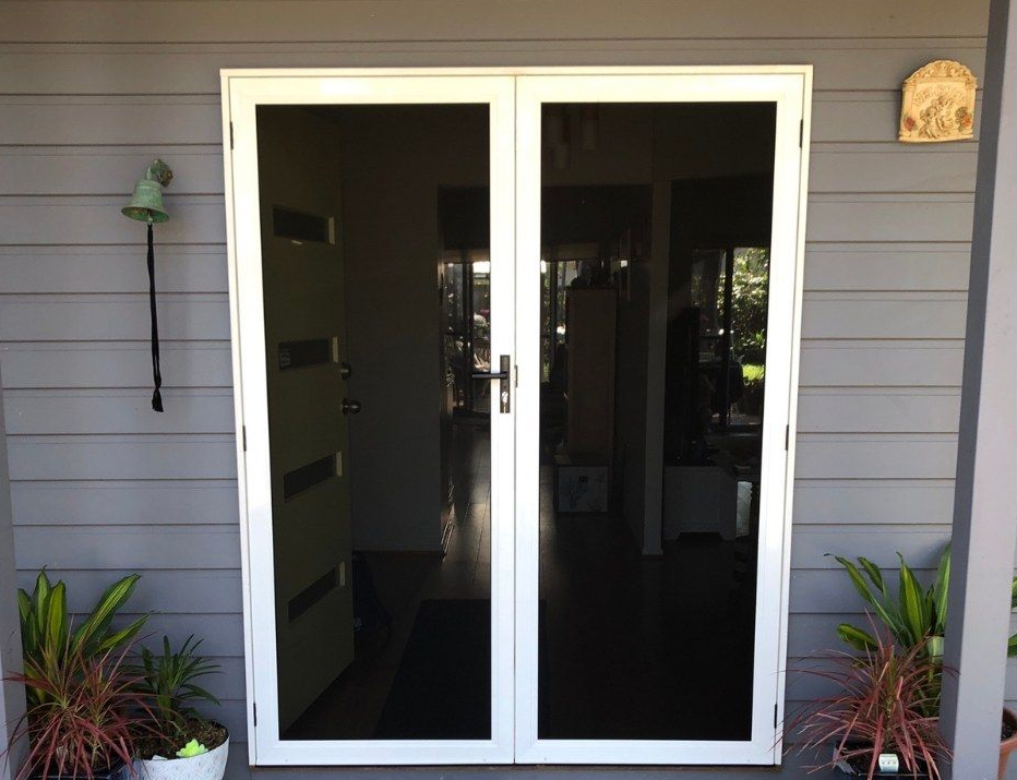 A Wooden Sliding Glass Door With A Screen On It — Screen Factory In Billinudgel, NSW