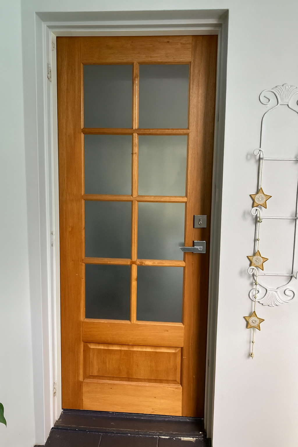 A Wooden Door With Frosted Glass And A Hanging Decoration On The Wall — Screen Factory In Billinudgel, NSW