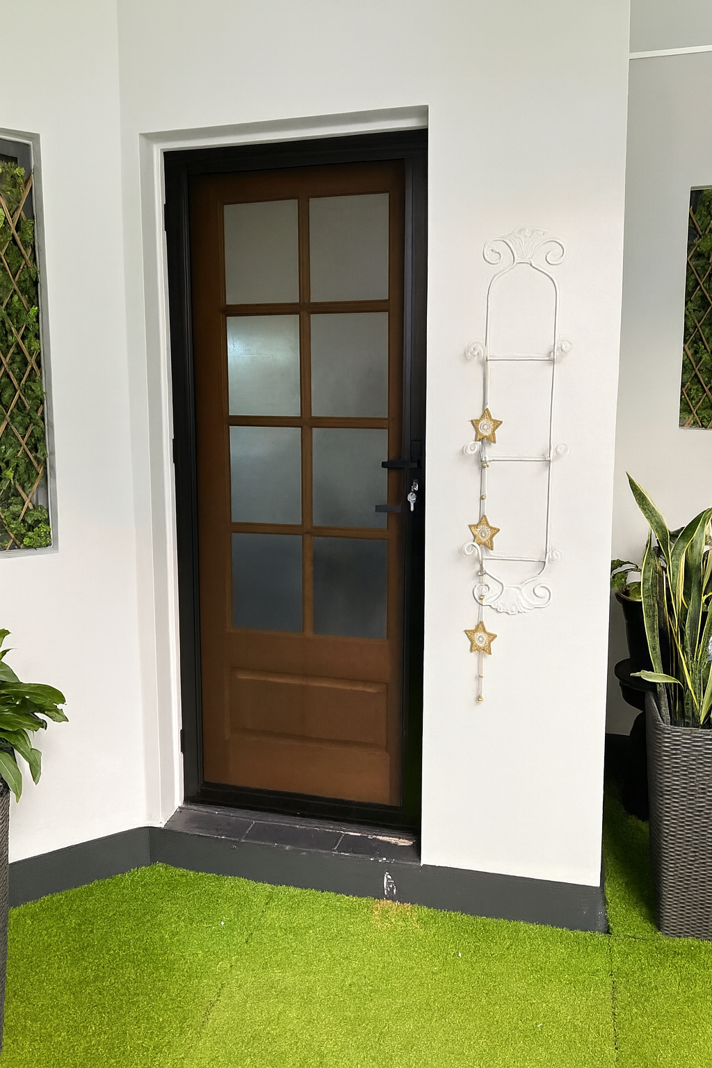 A Door With A Ladder Hanging On The Wall Next To It — Screen Factory In Billinudgel, NSW