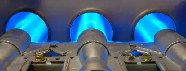 Blue flames from a furnace burner.